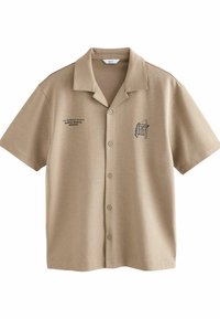 Beige short-sleeve shirt with a collar. Features a printed design on the left side and five front buttons. Made of a smooth fabric.