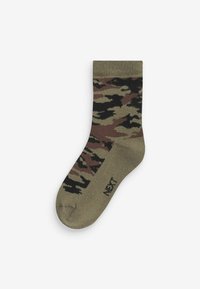 Grüne camouflierte Socken mit einem strukturierten Muster in Schwarz- und Brauntönen, geripptem Bündchen und einem Markenlabel an der Sohle.