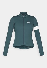 Chaqueta de ciclismo en azul oscuro con mangas largas, cuello alto, cierre completo y detalle de banda blanca en una manga. Fabricada con una tela ajustada y elástica.