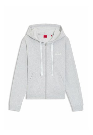 Lichtgrijze hoodie met rits, koordjes en een buidelzak. Voorzien van subtiele branding op de borst en gemaakt van een zachte, getextureerde stof.
