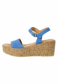 Sandale à plateforme en liège bleu en suède, avec une bride ajustable à la cheville et un design à bout ouvert. Texture lisse avec des détails de couture minimalistes.