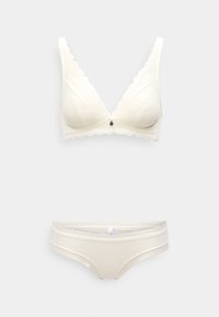 Σετ ελαφριάς ελεφαντόδοντης εσωρούχων που περιλαμβάνει ένα бралет με V-λαιμόκοψη και κυματιστές άκρες, καθώς και αντίστοιχες εσώρουχα. Και τα δύο διαθέτουν υφασμάτινη υφή και ευαίσθητη διακόσμηση.