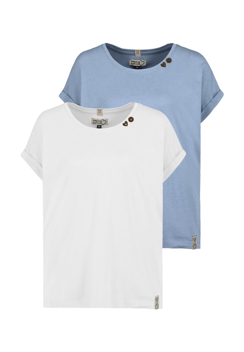 Two short-sleeve t-shirts: one white with three heart-shaped buttons near the collar, and one light blue with rolled sleeves, both made of soft fabric.
