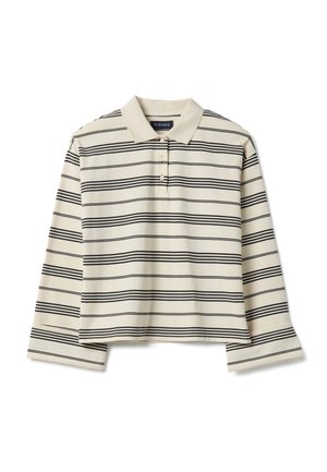 Striped cropped polo shirt with long sleeves in cream and black. Features a standard collar and three button placket. Soft fabric texture.