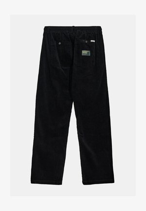 Pantaloni in velluto a coste neri con una vestibilità rilassata, caratterizzati da una vita elastica, due tasche posteriori e un'etichetta in tessuto sulla tasca destra.