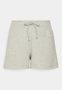 Shorts en coton gris avec une texture douce, une taille élastique et un cordon de serrage. Présente le mot "GAP" brodé sur le côté.