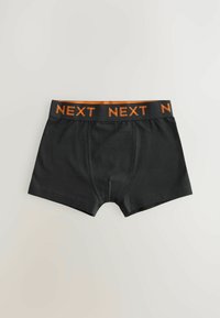 Černé boxerky vyrobené z měkké látky, mají jednobarevný design a oranžové logo "NEXT" na elastickém pásku.