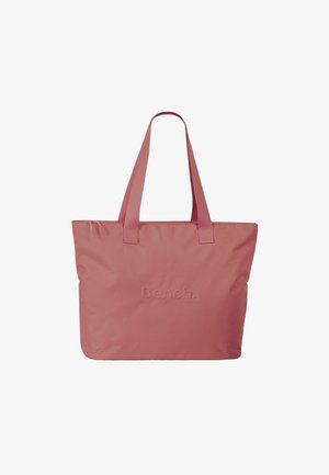 Sac fourre-tout rose en tissu durable, avec deux poignées solides et un logo en relief subtil sur le devant. Design simple et fonctionnel.
