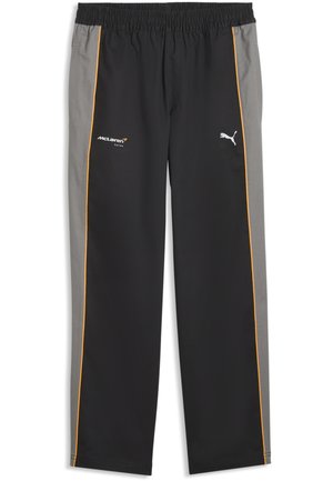 Pantalones de carreras Puma McLaren en negro y gris con ribetes naranjas, cintura elástica y logotipos en los muslos delanteros.
