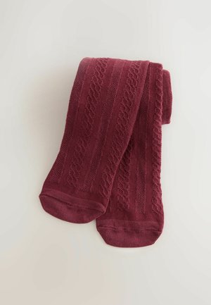 Vínové podkolenky s texturovanými vzory, které mají žebrované detaily a hladký povrch, pečlivě složené na světlém pozadí.