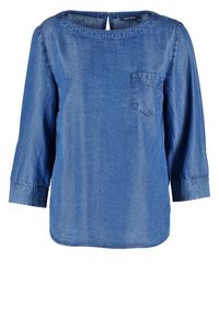 Haut en denim, manches longues, encolure arrondie, poche avant et détail en forme de clé à l'arrière. Tissu bleu clair légèrement texturé.