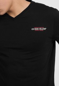 Guess Jeans COL V AMERICAN TRADITION - Apdrukāts T-krekls - nero