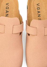 V.GAN clogs in soft pink material with a matte finish, featuring two side straps and a textured cork insole. Size marked as 38.