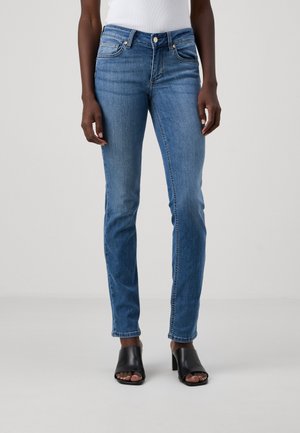 Light blue denim jeans with a slim fit, slightly faded texture, classic five-pocket design, and a button closure. Hem is straight.