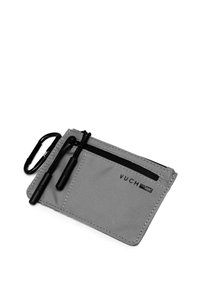 Gray fabric card holder with two zippered compartments, black hardware, and a carabiner clip. Features brand logo embossed on the front.