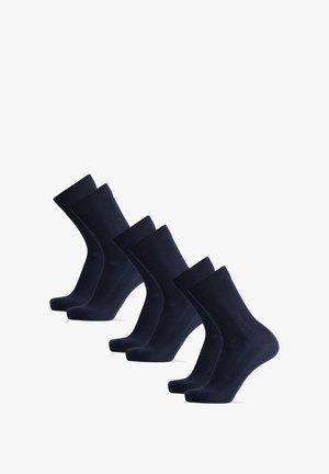 Mørkeblå bomuldsstrømper i et sæt af fire, med ribbede kanter, en glat tekstur og et klassisk crew-længde design.