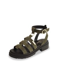 Sandalo in suede verde oliva con punta aperta, molteplici cinturini e un cinturino alla caviglia con fibbia. Presenta una suola nera chunky con battistrada testurizzato.