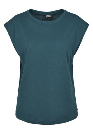 Teal kortärmad t-shirt med rund halsringning, lös passform och sidoklipp, tillverkad av mjukt bomullstyg. Har en etikett inuti.