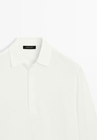 White long-sleeve polo shirt with a classic collar and three-button placket, labeled Massimo Dutti.