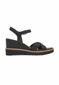 Sandali con zeppa nera, realizzati in pelle intrecciata, con cinturino alla caviglia e suola testurizzata. Presentano un accento in sughero sulla soletta e un design minimalista.