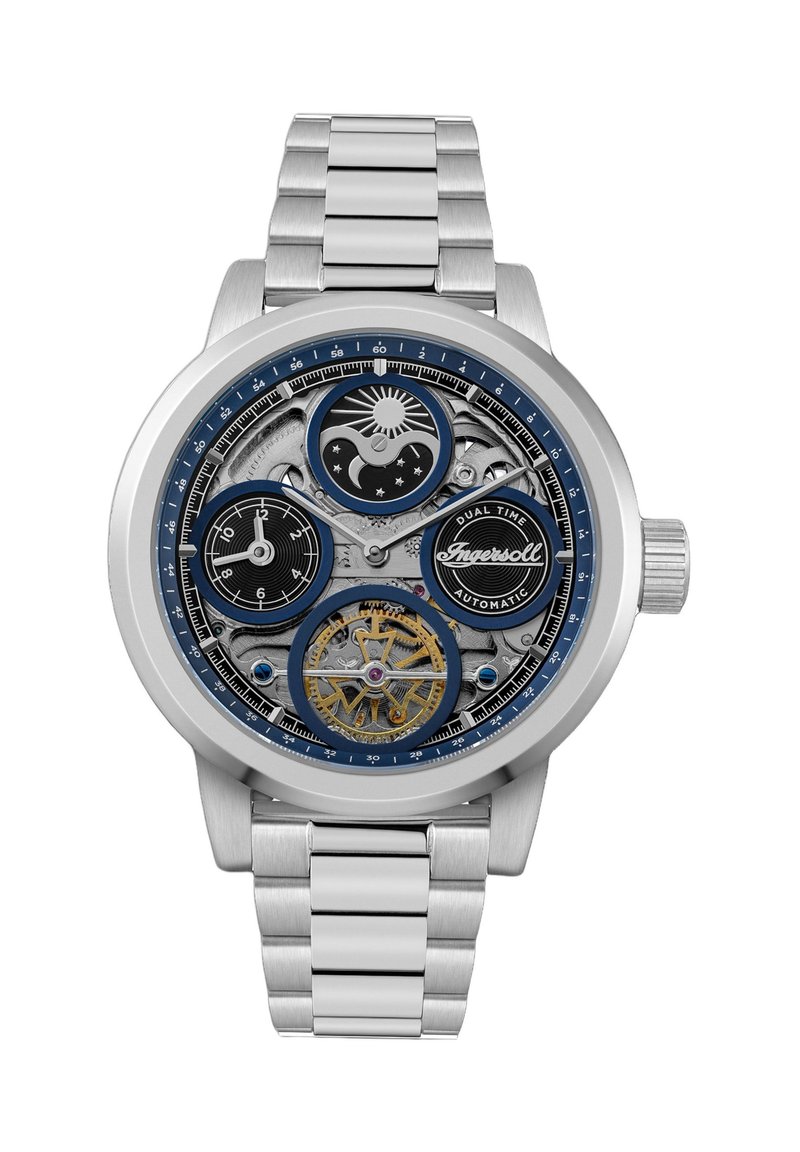 Heren automatisch horloge met een zilveren roestvrijstalen armband, blauwe en zwarte wijzerplaat, zichtbare tandwielen, en dubbele tijdzones aangegeven.