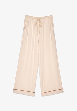 Svetlo bež široke hlače iz mehkega materiala. Imajo elastiko v pasu s vrvico in kontrastno rjave obrobe na robovih.