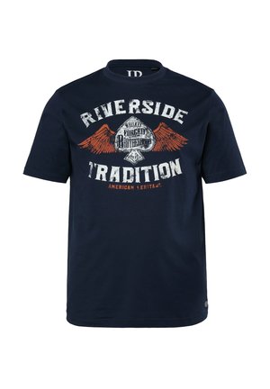 T-shirt en coton bleu marine avec un graphique comprenant des ailes orange et un texte blanc indiquant "TRADITION RIVERSIDE" et "HÉRITAGE AMÉRICAIN".