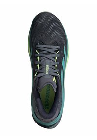 Black and teal athletic shoe with textured mesh upper, green accents, round toe, and gray laces. "SUPERNOOVA" branding on tongue.