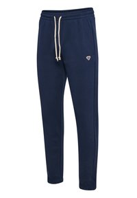 Pantaloni della tuta blu navy realizzati in morbido misto cotone con vita elasticizzata, cordoncino e un piccolo logo ricamato sul lato.