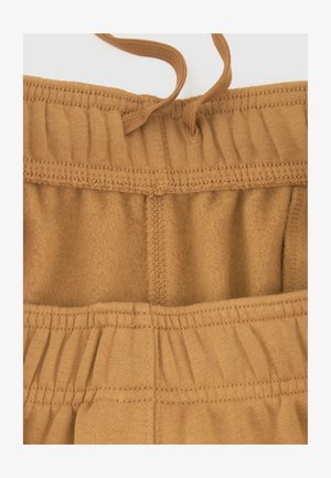 Bruine katoenen tailleband met elastiek en trekkoord. Zachte, fleece-achtige binnenvoering met zichtbare stikdetails. Eenvoudig en functioneel ontwerp.