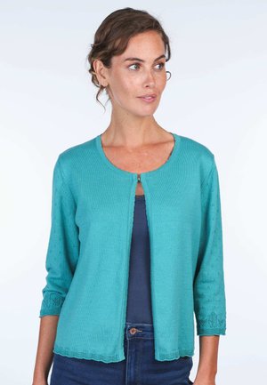 Turquoise cardigan with three-quarter sleeves, round neckline, decorative stitching on sleeves, and a stitched hem. Lightweight material.
