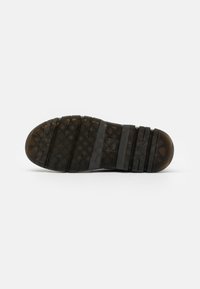 Dr. Martens Bottines à plateau - black