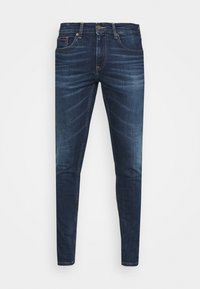 Tmavě modré džíny z denimové látky se slim fit střihem, pěti kapsami a jemným vyblednutím, se zapínáním na knoflík a logem na zadním pásu.