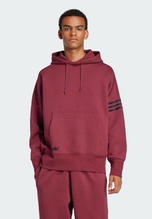 Burgundy hooded sweatshirt with a kangaroo pocket, featuring three black stripes along one sleeve, made from textured cotton blend.