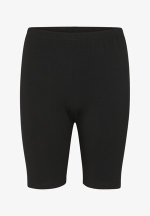 Melnas stieptas bikses no gludas auduma, kurām ir elastīga josta un pieguļoša uzbūve, beidzoties virs ceļgala.