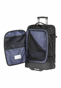 Valise à roulettes noire avec un intérieur spacieux, comportant une doublure bleue, une poche en maille et des compartiments zippés pour l'organisation.