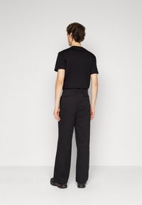 Calvin Klein MODERN RELAXED WIDE - Broek - black