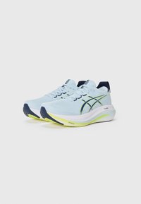 Light blue running shoes with white sole, navy accents, breathable fabric, rounded toe, and distinctive striped design on the sides.