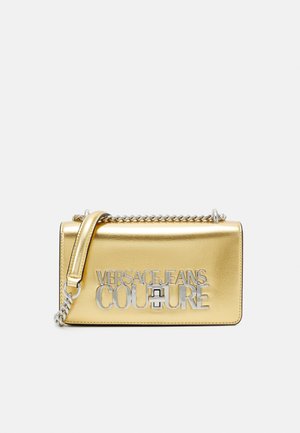 Gold metallic rectangular handbag with silver chain strap and "Versace Jeans Couture" silver lettering on front.