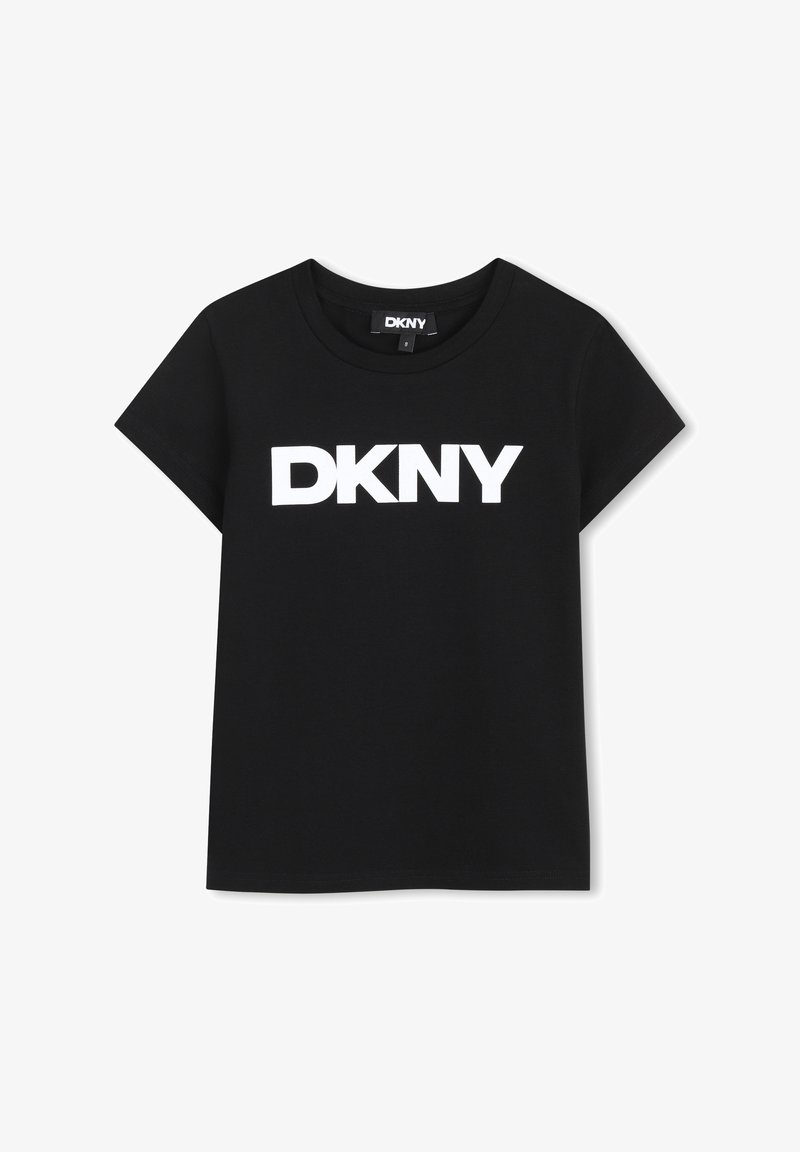 T-shirt en coton noir à manches courtes et col rond, avec un grand logo blanc "DKNY" imprimé sur le devant. Texture lisse.