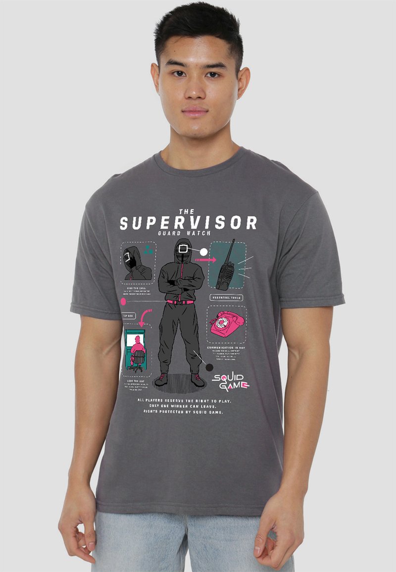 Gray short-sleeve t-shirt featuring a graphic print inspired by "Squid Game" with illustrated elements, text, and contrasting colors.