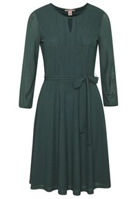 Pitkähihaiset, tummanvihreät mekko, jossa on pyöreä pääntie, vyönauha vyötäröllä ja pistekuviointi kauttaaltaan. Sopii rentoihin tai virallisiin tilaisuuksiin.