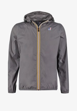 Gray lightweight jacket with a hood, featuring a front zipper with yellow and white stripes, and a logo on the chest. Smooth texture.