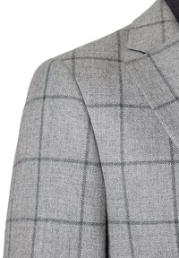 Szary wełniany żakiet z subtelnym wzorem w kratkę. Posiada klapy typu notch oraz teksturowany materiał. Widoczny szew na ramieniu i dopasowany krój.