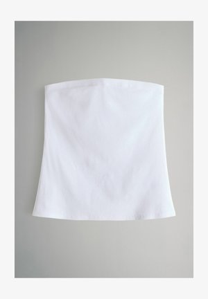 Valge pidulik ilma rihmadeta seelik, mis on valmistatud ribakudumist, millel on sile tekstuur ja laienev äär. Lihtne disain, ilma täiendavate kaunistusteta.