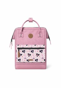 Pink backpack with a smooth exterior, features a front pocket decorated with hearts and eyes pattern, and a top handle for carrying.