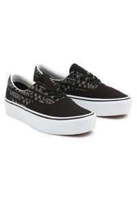 Black canvas sneakers with a white rubber sole, featuring black and gray checkerboard patterns and "VANS" logo accents on the side.