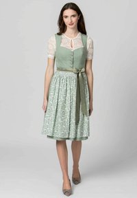 Light green dirndl with a fitted bodice, lace sleeves, button detail, and a floral-patterned skirt. Finished with a matching satin ribbon.