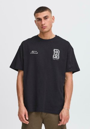 Black cotton t-shirt featuring a loose fit, crew neck, and embroidered lettering on the chest, with subtle logo detailing.
