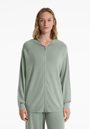 Hellgrüner, gerippter Reißverschluss-Hoodie mit Kapuze und langen Ärmeln. Aus strukturiertem Stoff gefertigt, mit lockerer Passform und Reißverschluss.